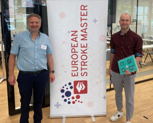 Portrait of Simon Jung and David Tanner with Stroke MAS Banner